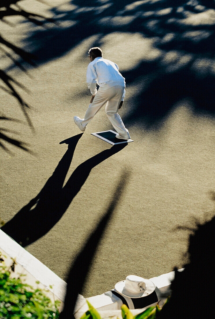 Man On Lawn Of Oura