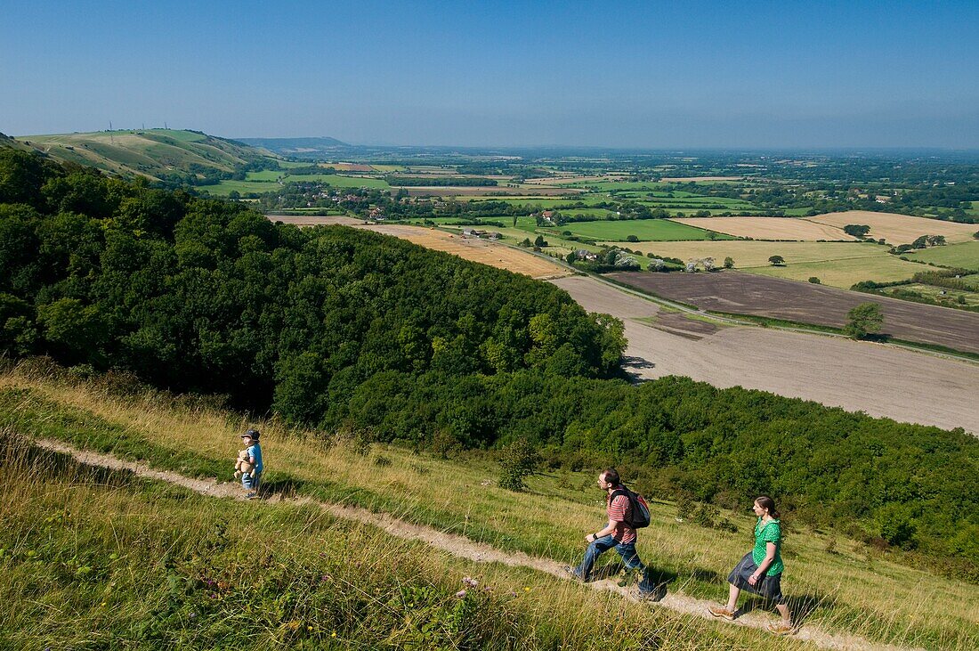 Couple With Boy Walking Along Path At Devil's Dyke Near Brighton