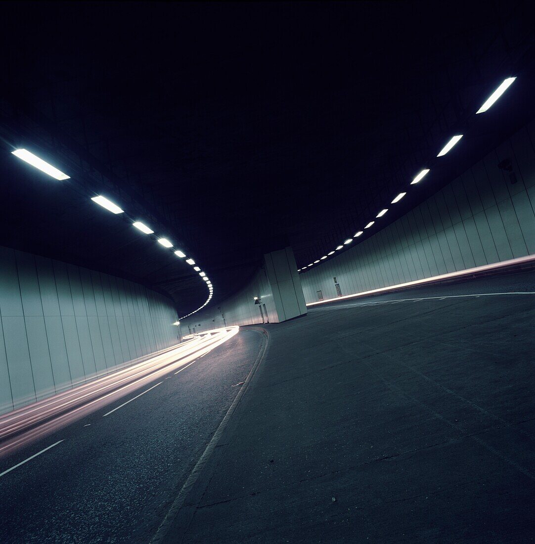 Car Tail Lights Through Tunnel