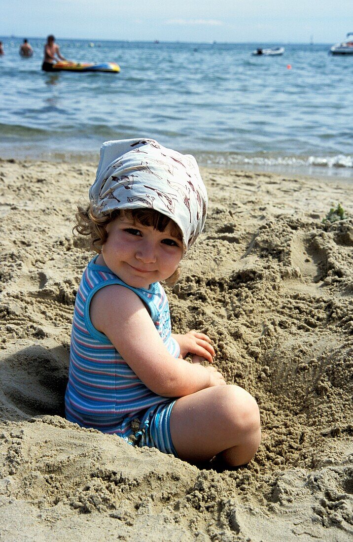 Young Girl Playing On Beach In Sands