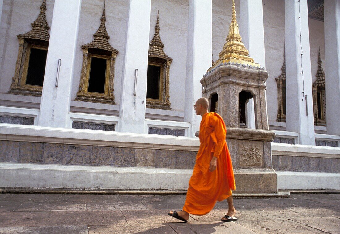 Buddhist Monk Walking Outside Temple