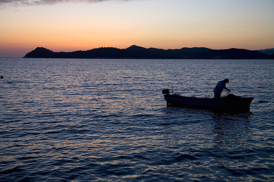 Fisherman In Boat At Dusk, Lopud,Croatia