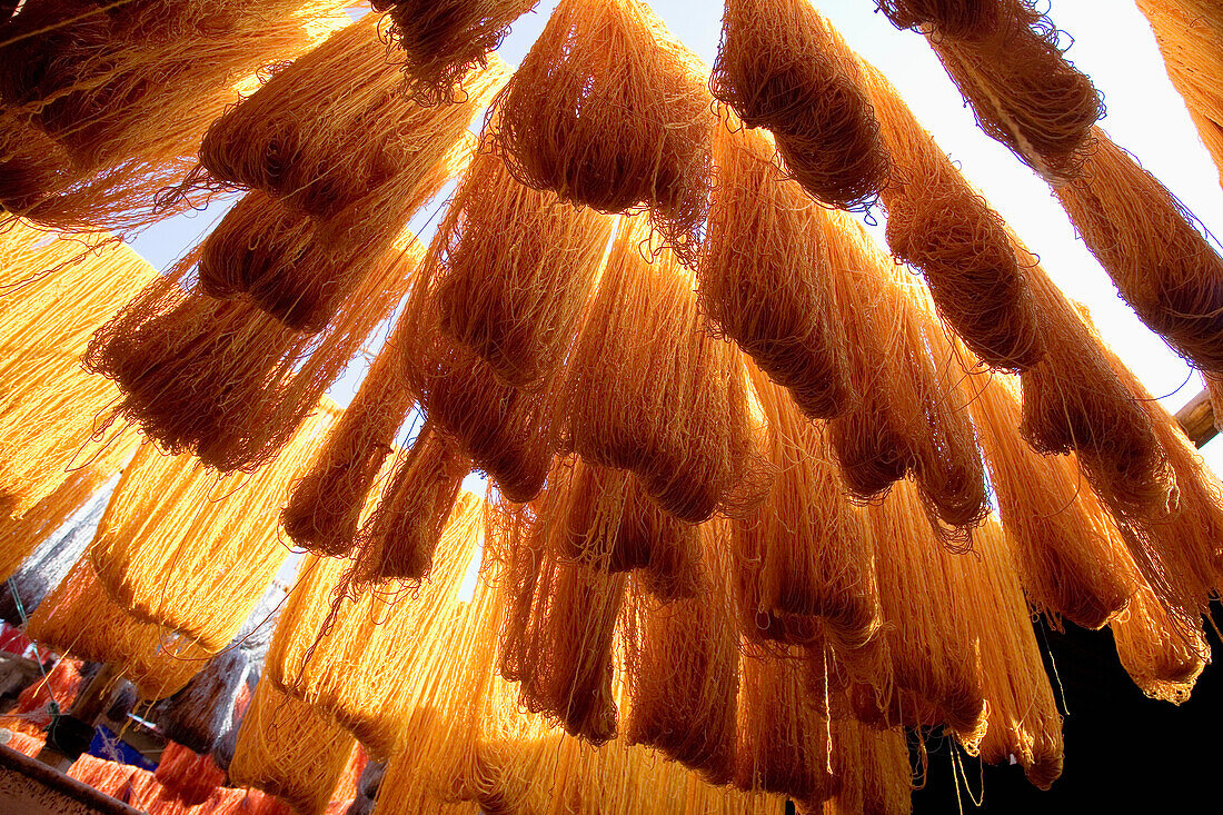 Safron Dyed Cloth Hanging Up To Dry In Souks Of Marrakesh, Morocco
