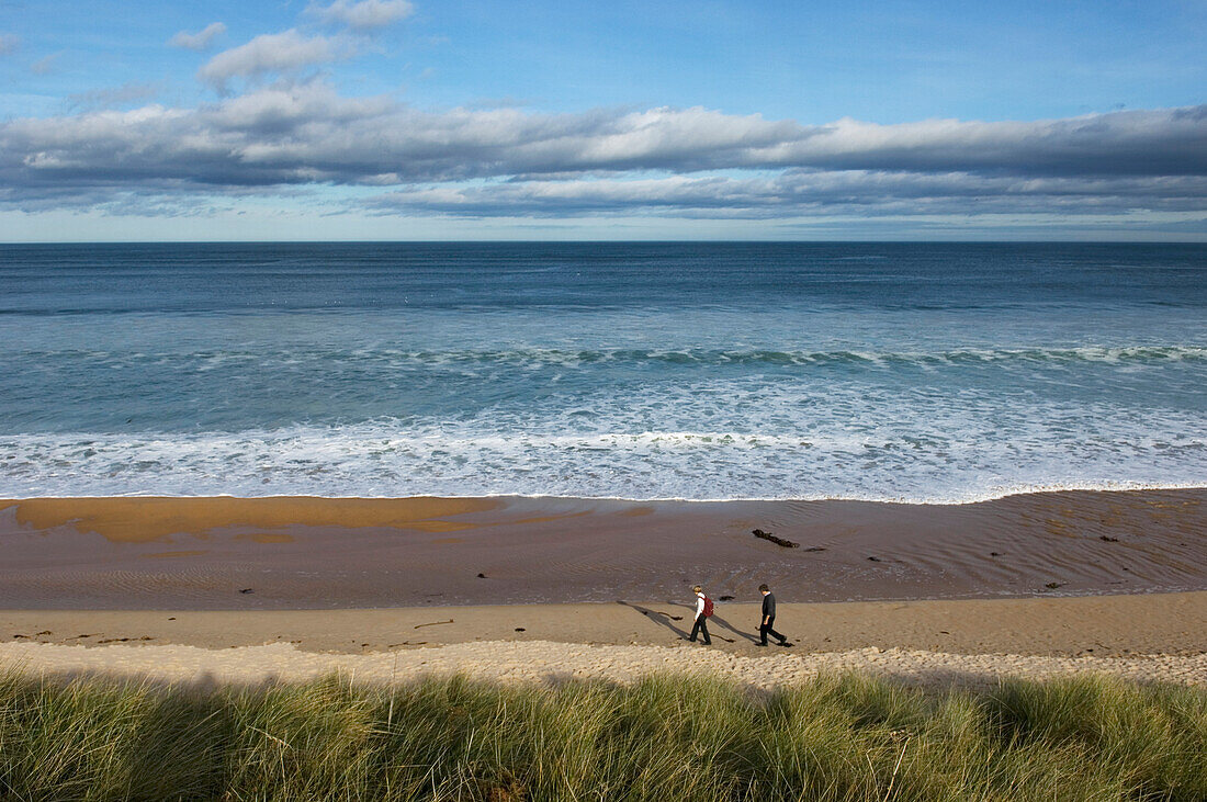 Two Hikers At Embleton Bay, Northumberland,Uk