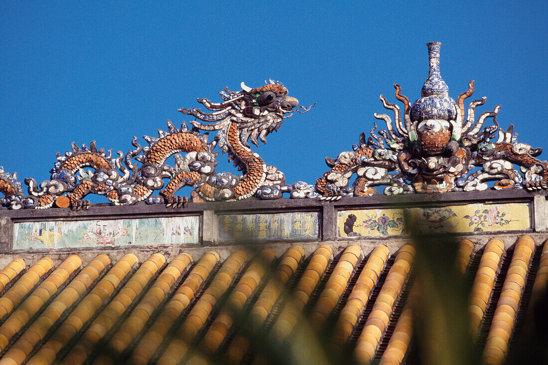 Detail Of Building With Dragon As Viewed Through Palm Leaves,Forbidden City,Hue City,Vietnam
