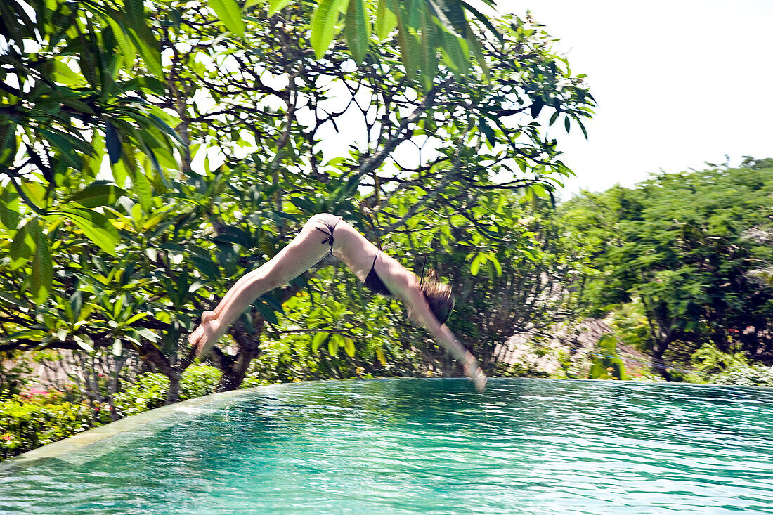 Young Woman By Hotel Swimming Pool