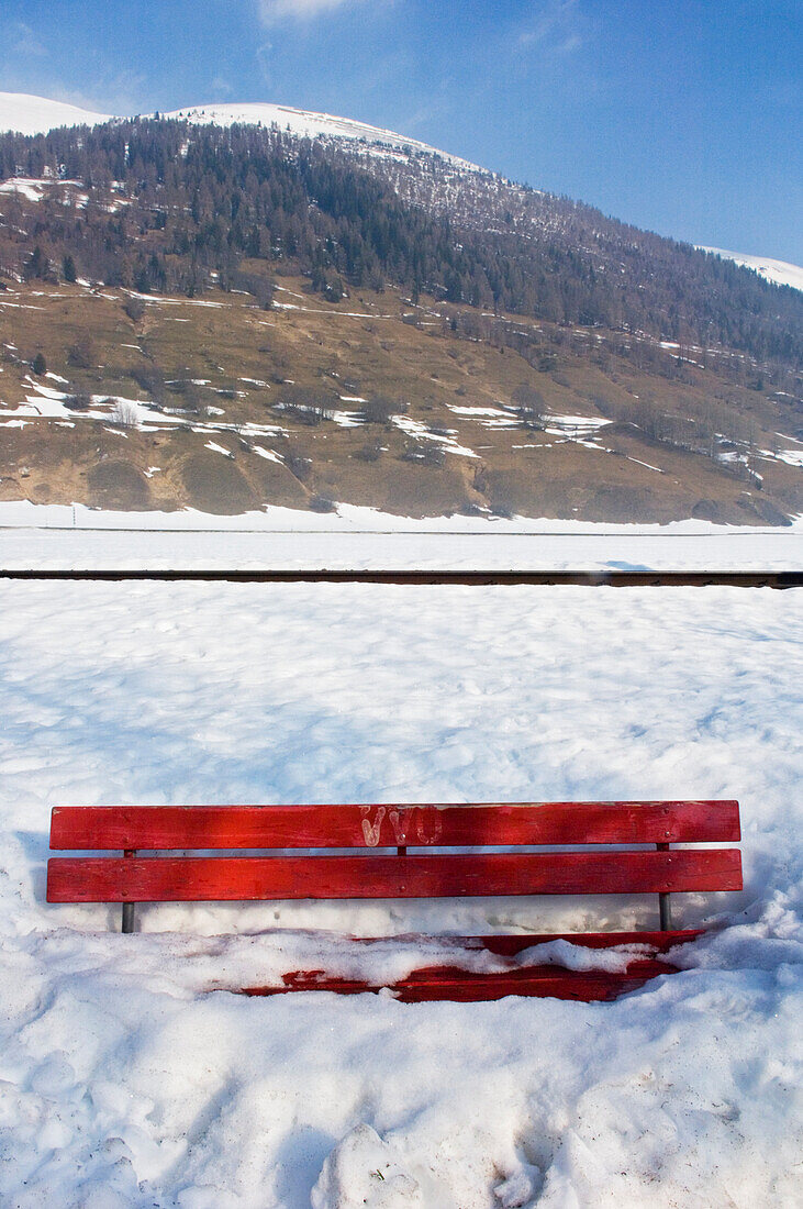 Snow-Covered Bench In Front Of Mountain, Goms Valley,Switzerland