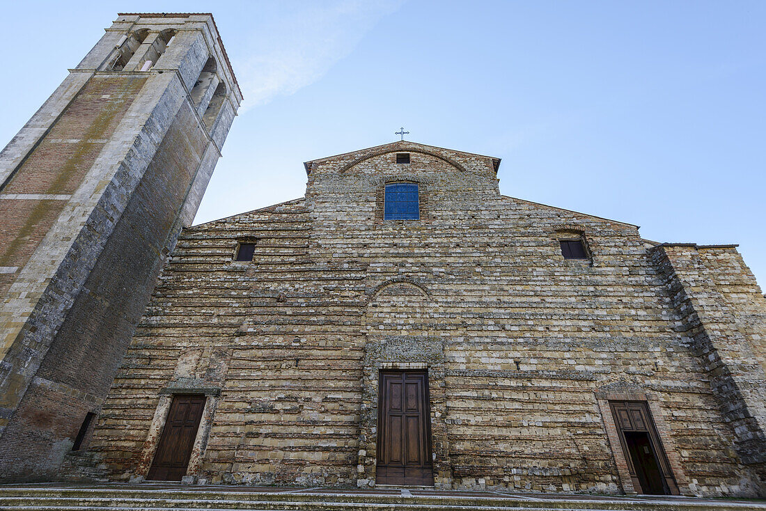 Low Angle View Of The Front Of The Ancient Dome Of Montepulciano With A Blue Sky; Tuscany, Italy