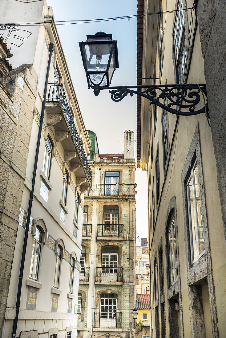 Narrow Street Lined With Buildings; Lisbon, Portugal