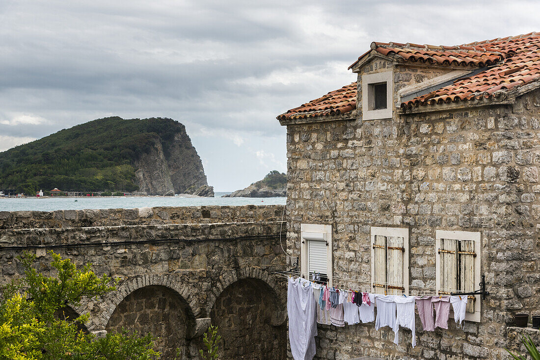 Clothesline outside an old stone house along the coast of the Adriatic Sea; Budva, Opstina Budva, Montenegro