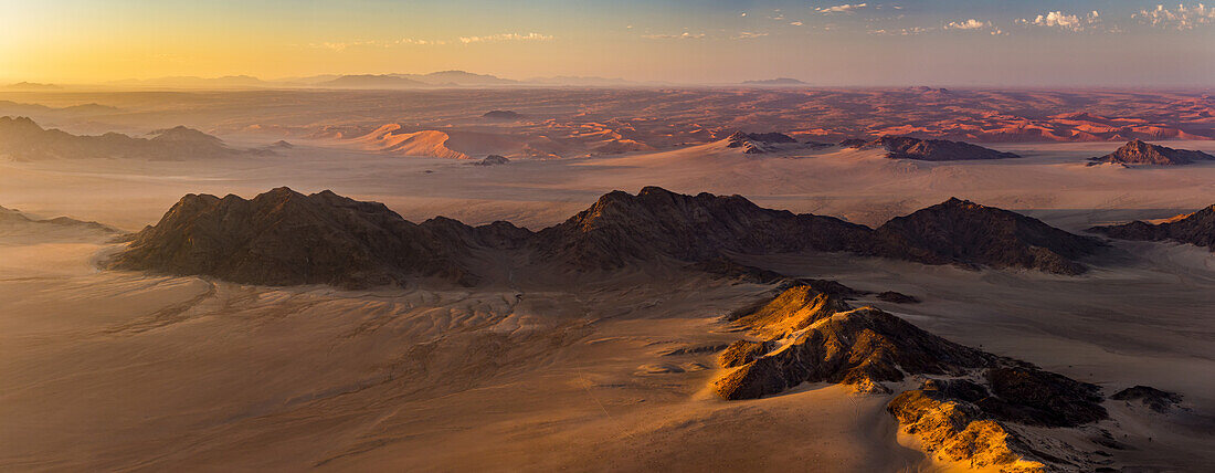 Aerial view of the sand dunes of the Namib Desert at sunrise; Sossusvlei, Hardap Region, Namibia