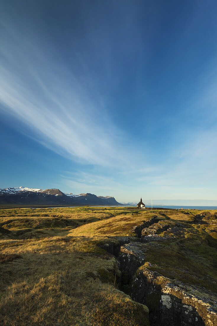 Church on lava fields at dusk, Snaefellsnes Peninsula; Budir, Iceland