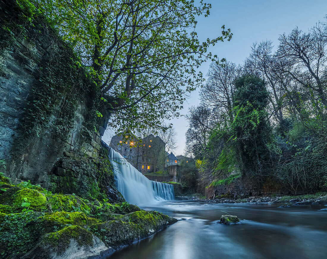 Edinburgh waterfall surrounded by medieval buildings; Edinburgh, Scotland