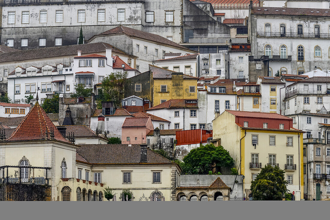 Buildings crowded together on a hillside; Coimbra, Portugal