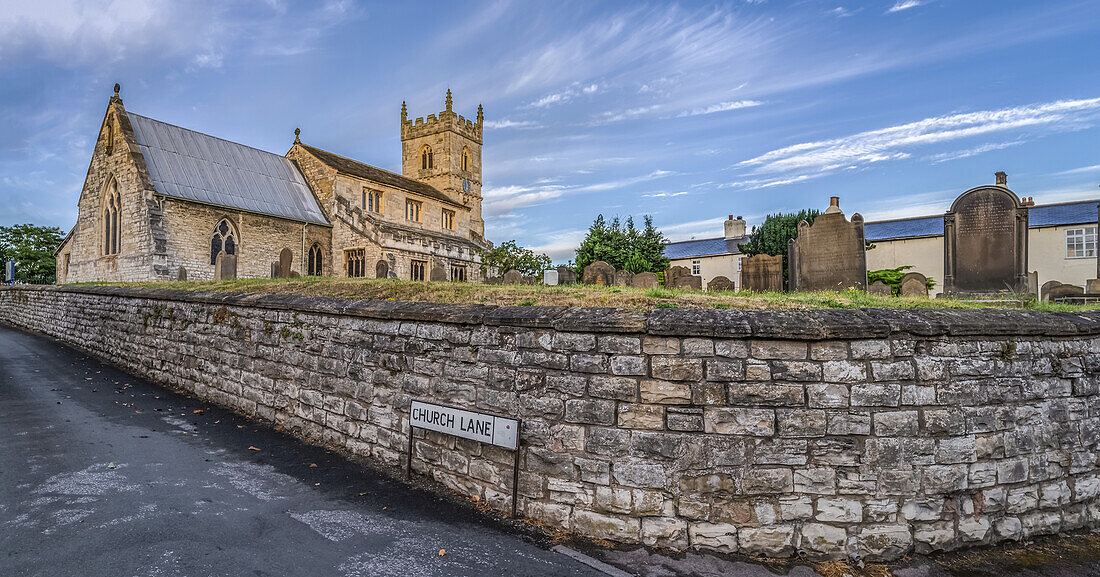 St. Wilfrid's Church in the village of Monk Fryston, North Yorkshire. The church dates largely to the thirteenth century, although the lower portion of the church tower is Anglo-Saxon in origin; Monk Fryston, North Yorkshire, England