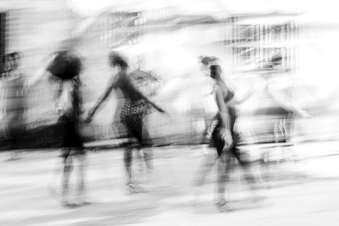 Black and white image of Cuban dance with dancers blurred in motion; Havana, Cuba