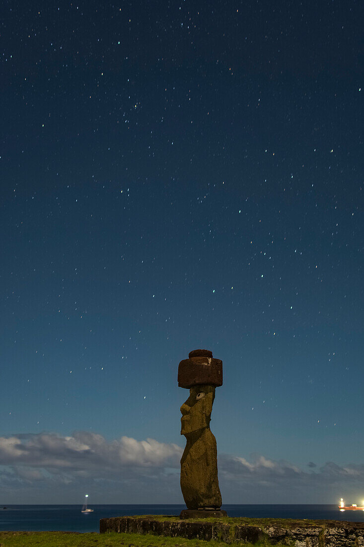 A single moai at night against a starry sky; Easter Island, Chile