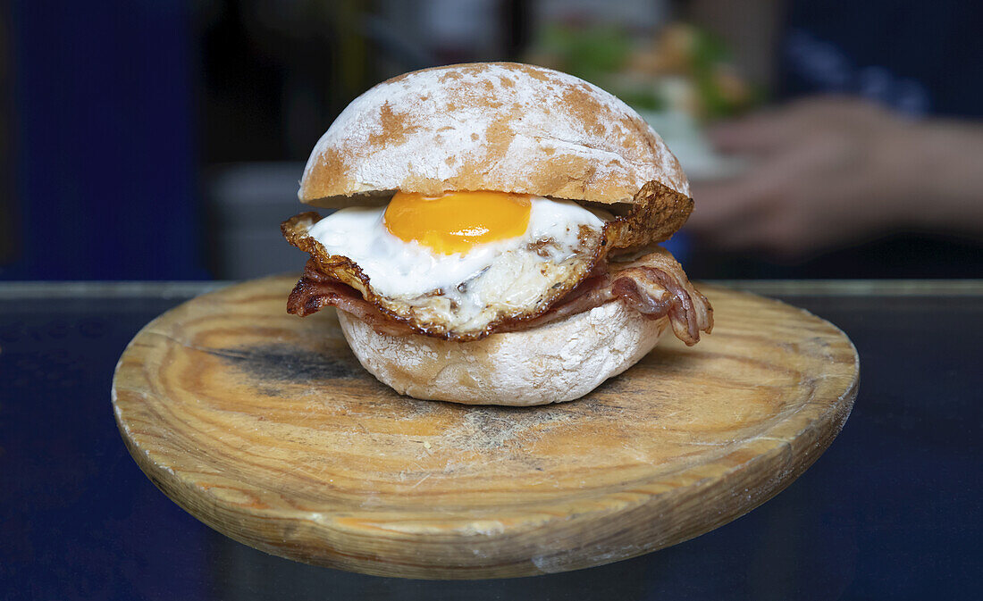 Fried egg breakfast sandwich; London, England