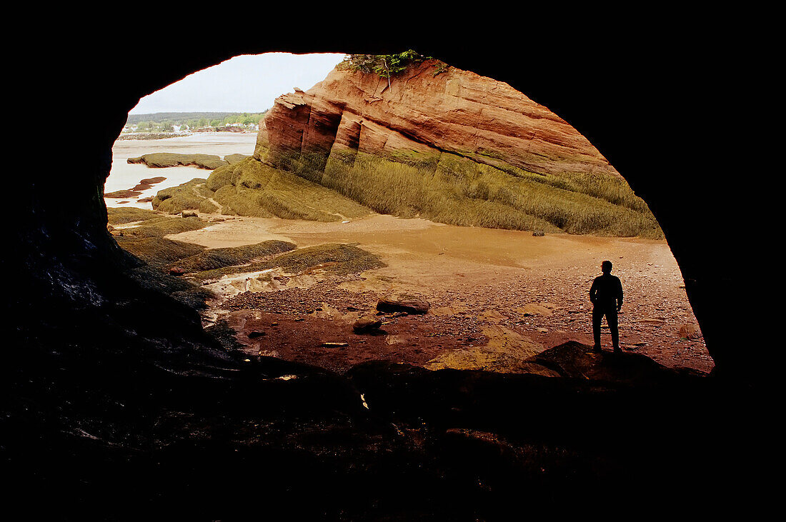 Person in Sea Cave at Low Tide Bay of Fundy, New Brunswick Canada