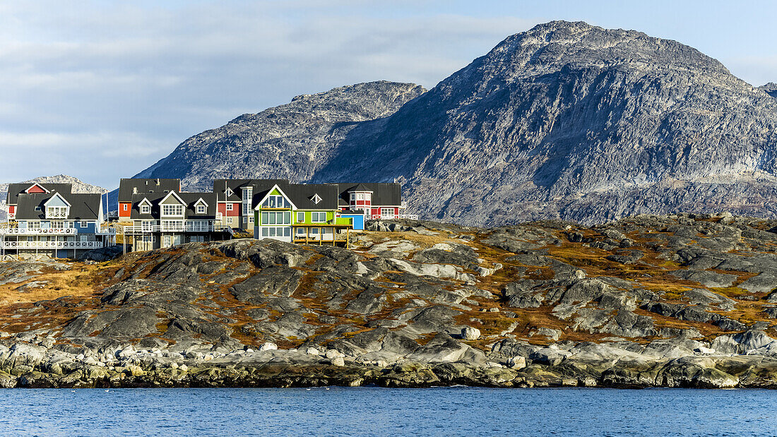 Colourful houses along the rocky shore of Nuuk; Nuuk, Sermersooq, Greenland