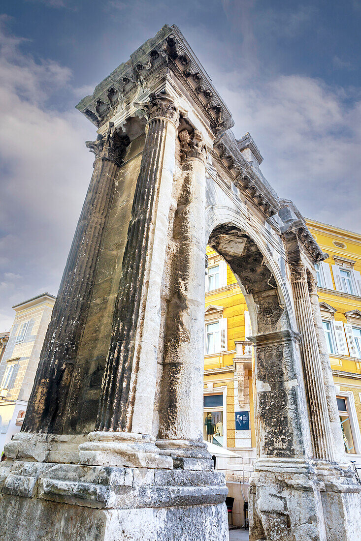 The Triumphal Arch of the Sergi, monument to the powerful Roman Sergi family, built in 1st Century BC, in the heart of the historical port city of Pula; Pula, Istria, Croatia