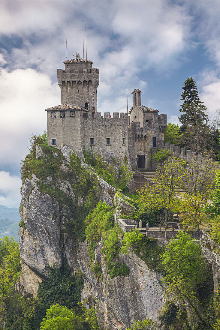 Cesta Tower on the peak of Mount Titan with a cloud filled sky on a sunny day;  Republic of San Marino, North-Central Italy