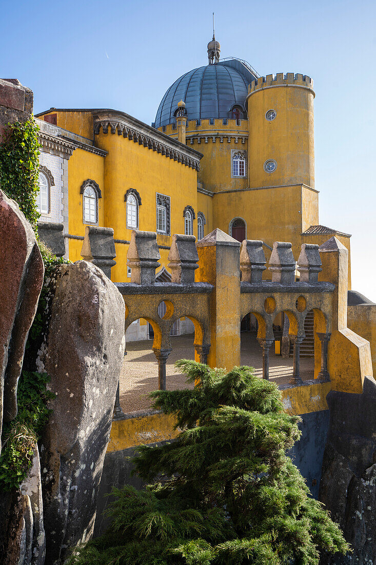 The hilltop castle of Palacio Da Pena with its domed tower and rooftop terrace situated in the Sintra Mountains; Sintra, Lisbon District, Portugal