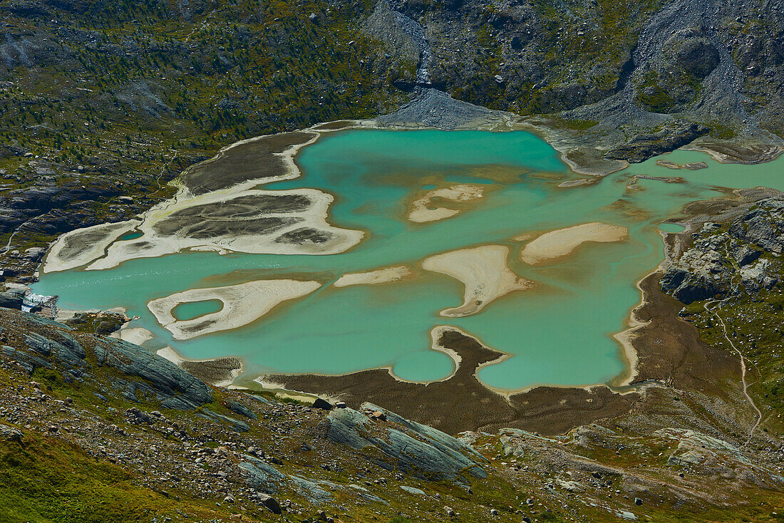 Lake of Glacier Pasterze from Gamsgrubenweg with its turquoise, muddy water and surrounding glacial ice mass, Franz-Joseph-Höhe on an early morning; Kärnten (Carinthia), Austria