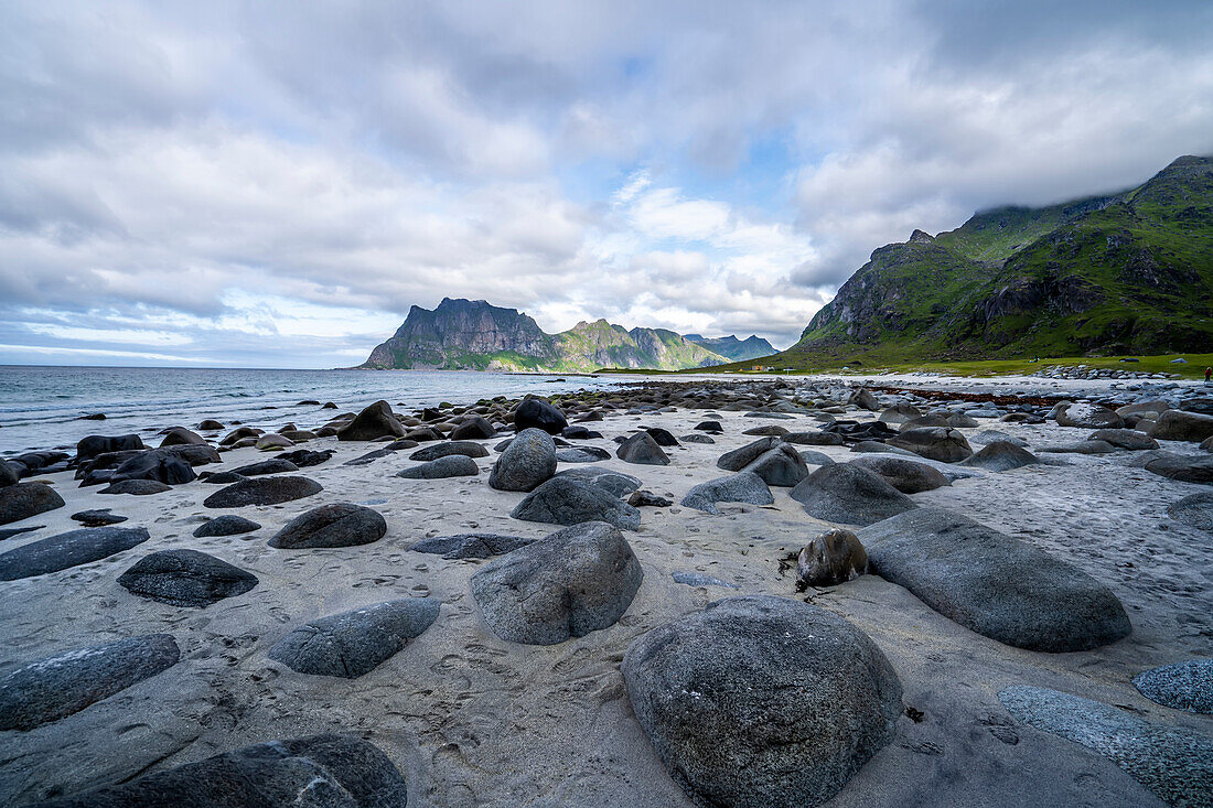 The dramatic coastal mountain and rock landscape of Uttakleiv Beach in Lofoten, Norway; Lofoten, Norway