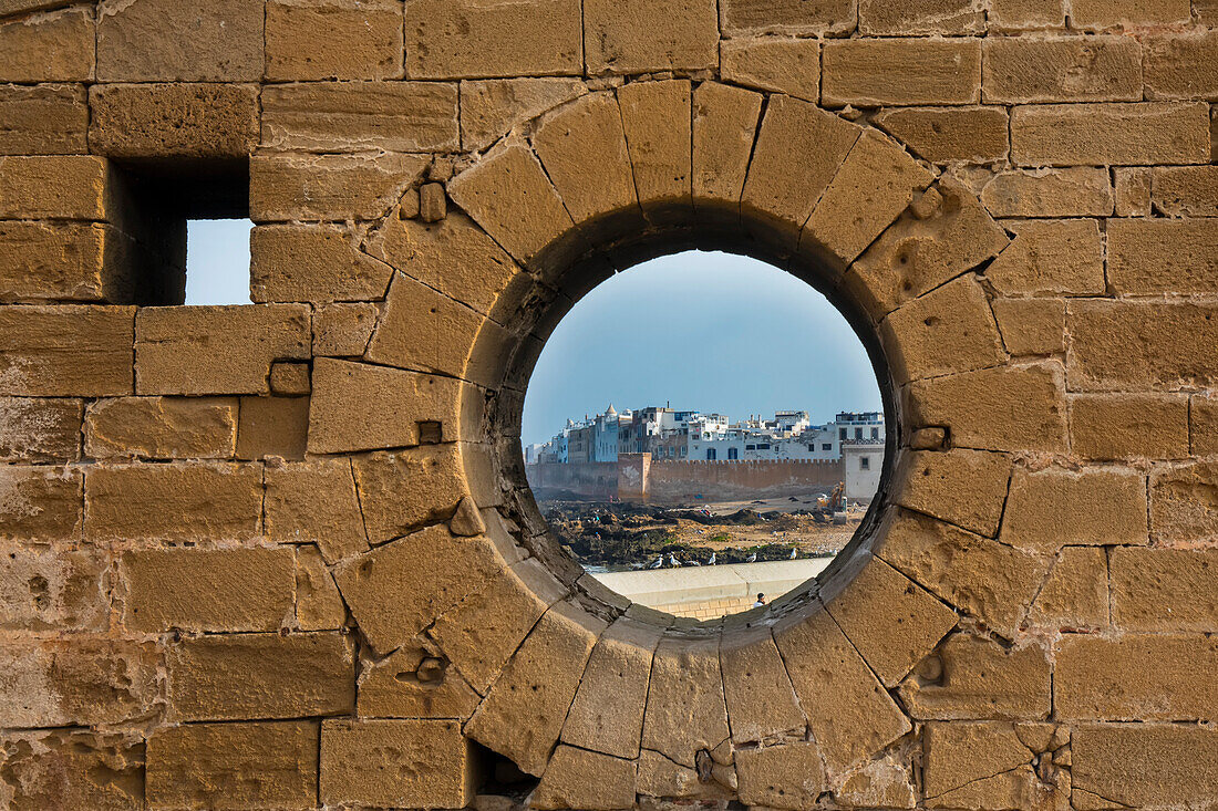 Circular window in the wall of the Sqala du Port walkway to the Essaouira Citadel; Essaouira, Morocco