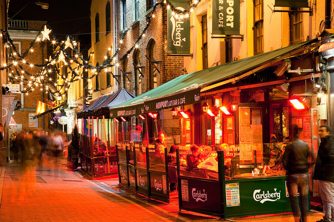 People On The Sidewalk Outside Restaurants And Shops; Cork City County Cork Ireland