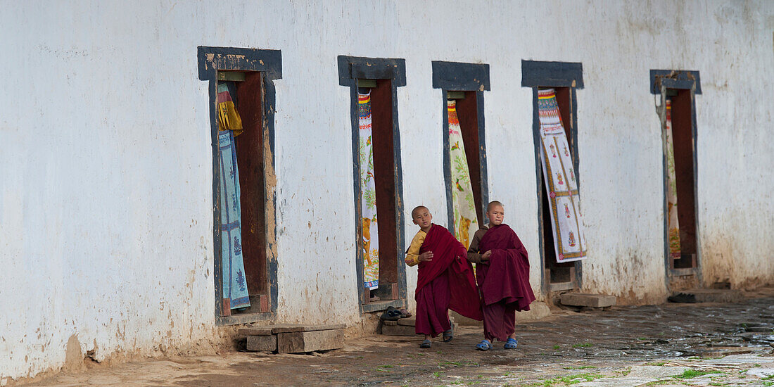 Two Novice Monks Walking In Gangte Goemba Monastery; Bhutan