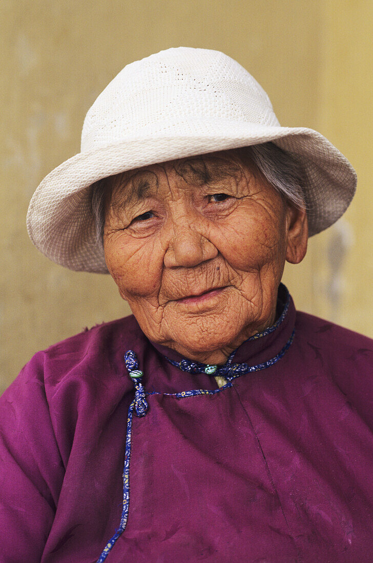 Mongolia, Local elderly woman in white hat; Ulaanbaatar