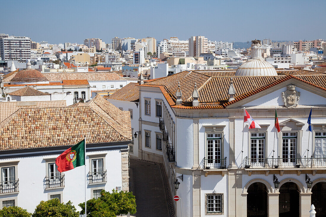 Flags On The Front Of A Building And A Cityscape With A Blue Sky; Faro Algarve Portugal