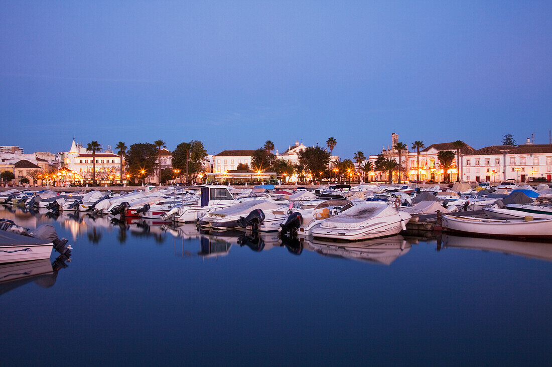 Boats In The Harbour Reflected In The Water At Dusk; Faro Algarve Portugal