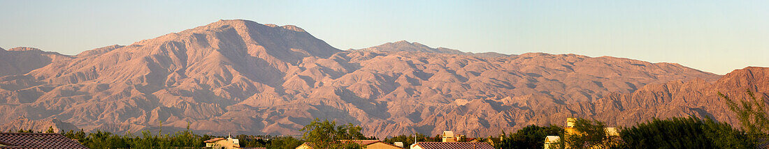 Panorama Of Desert Mountain Range At Sunrise With Blue Sky; Palm Springs California United States Of America