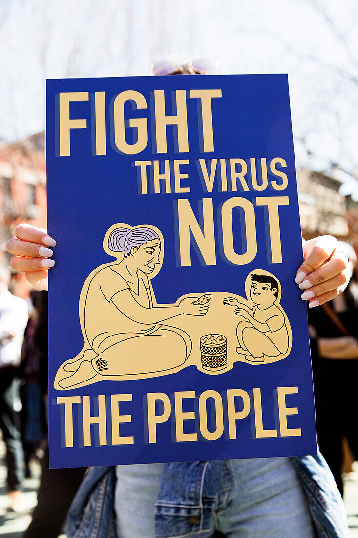 Fight the virus not the people! Sign at Anti-Asian Violence Rally, New York City, New York, USA