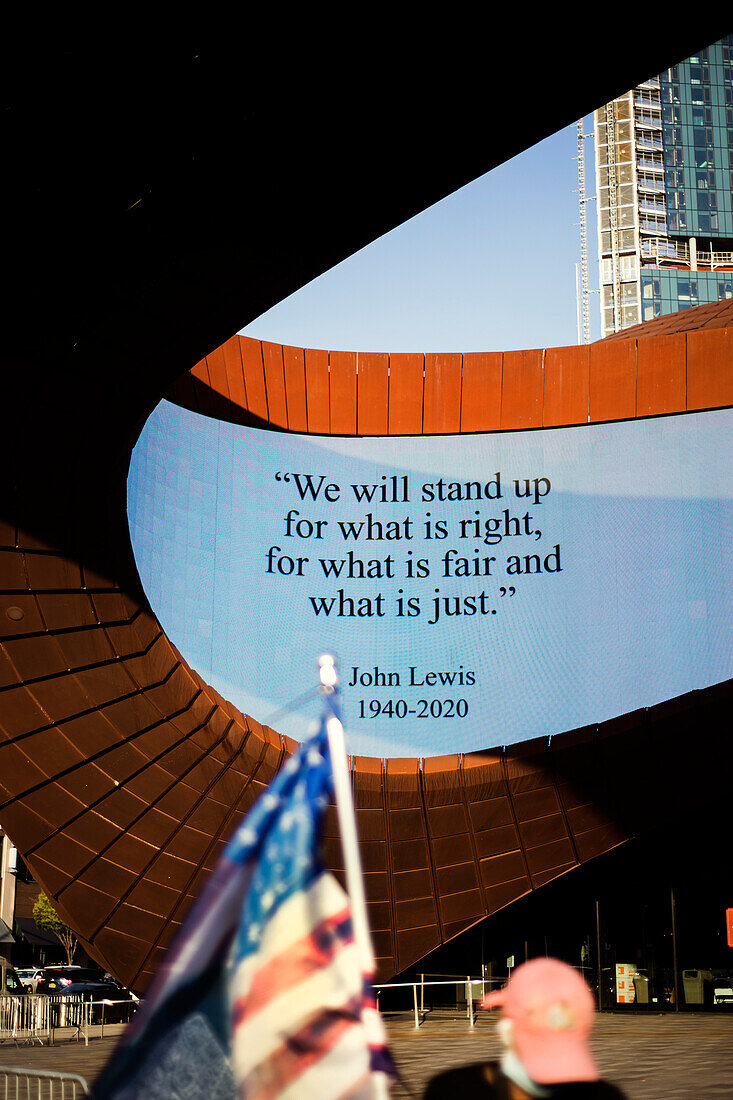 John Lewis Quote on digital sign with American flag in foreground, Barclays Center, Brooklyn, New York City, New York, USA