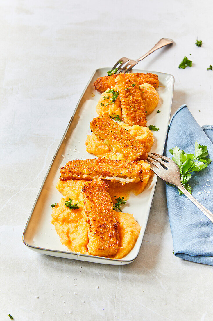 Fish fingers with pumpkin puree