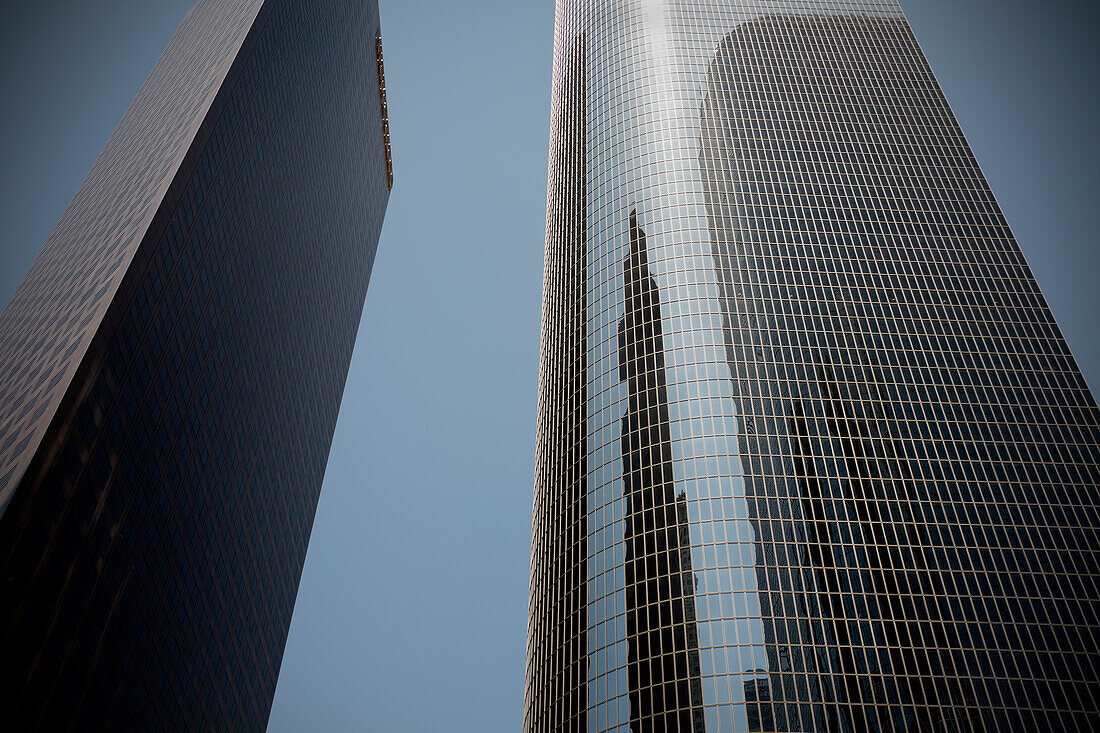 Low Angle View of Two Modern Office Buildings with Reflections, Los Angeles, California, USA