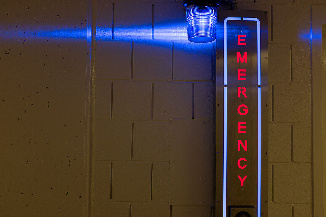 Illuminated Emergency Sign in Parking Garage