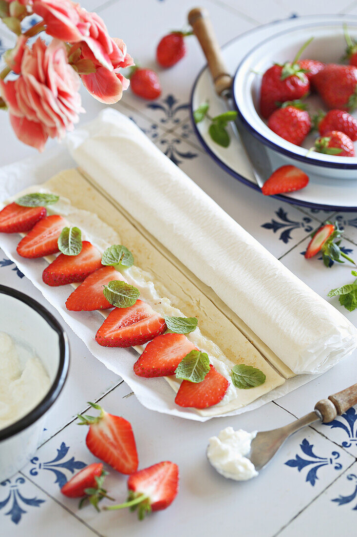 Preparing Simple puff pastry strawberry roll