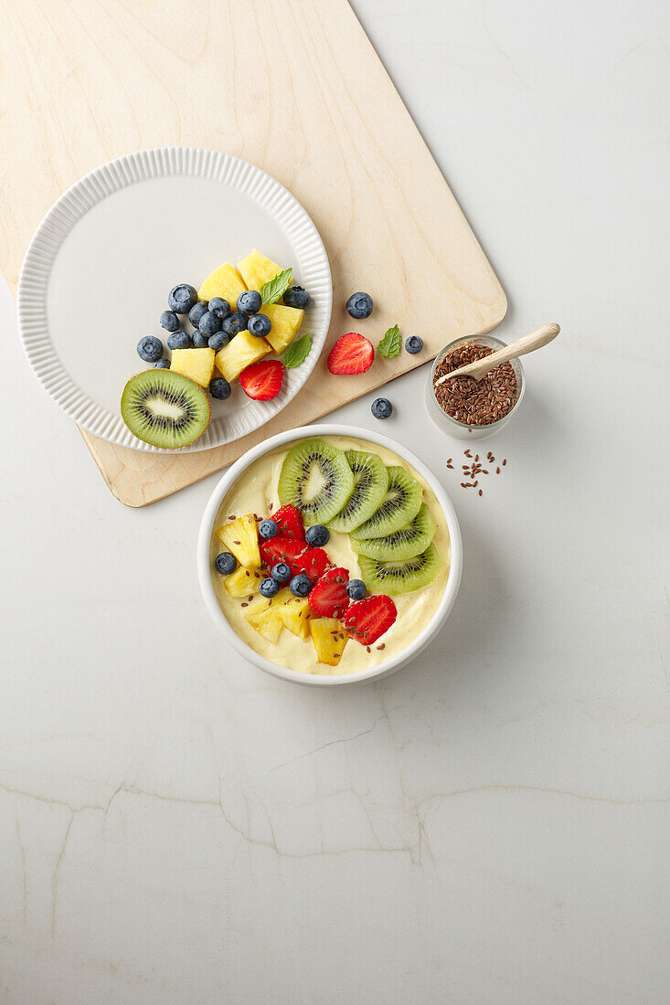 Smoothie Bowl with pineapple, kiwi, berries and chia seeds