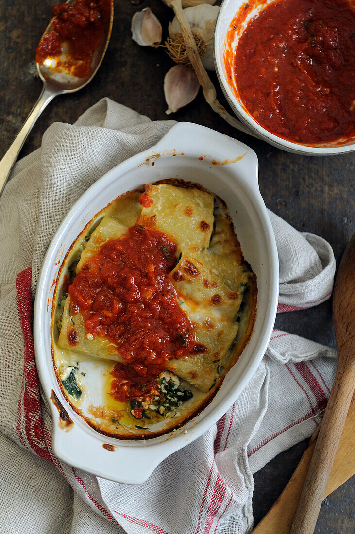 Oven-baked stuffed paccheri pasta with tomato sauce