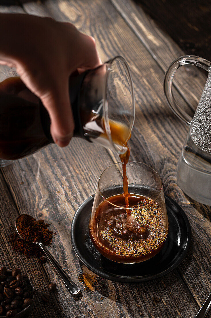 Black coffee poured into a glass