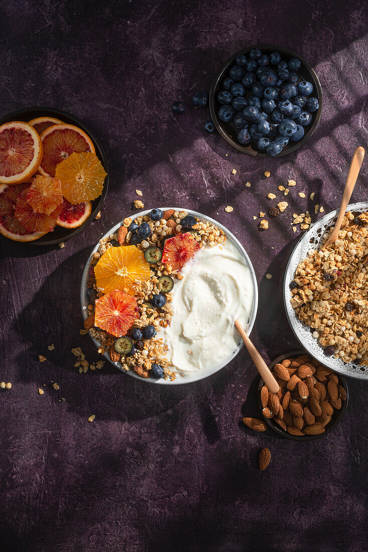 Yogurt with muesli, oranges, blueberries and almonds