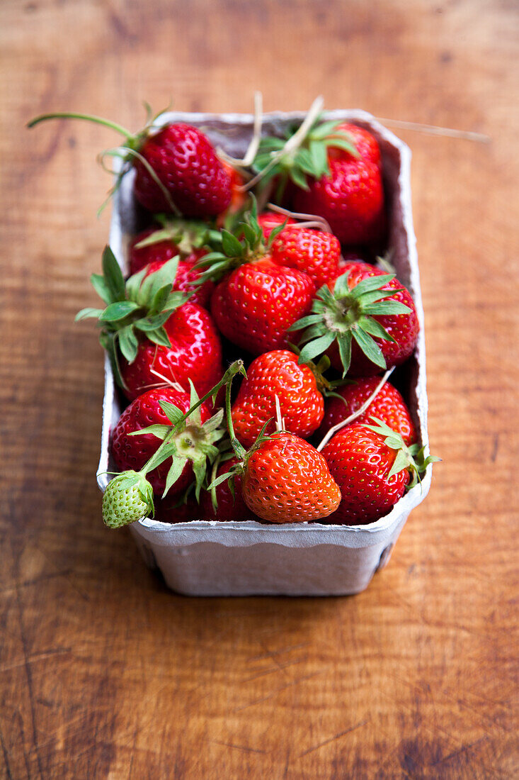 Fresh strawberries in a paper punnet