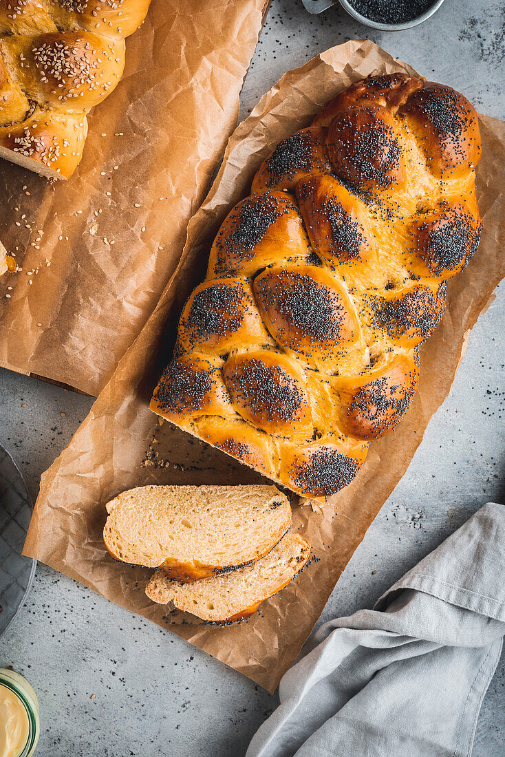 Challah (Jewish yeast plait with poppy seeds and sesame on Sabbath)