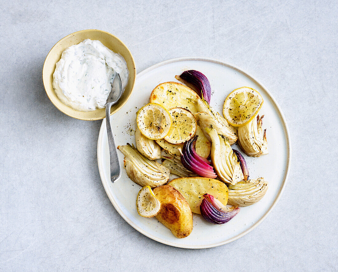 Lemon vegetables roasted in oven with herb curd cheese