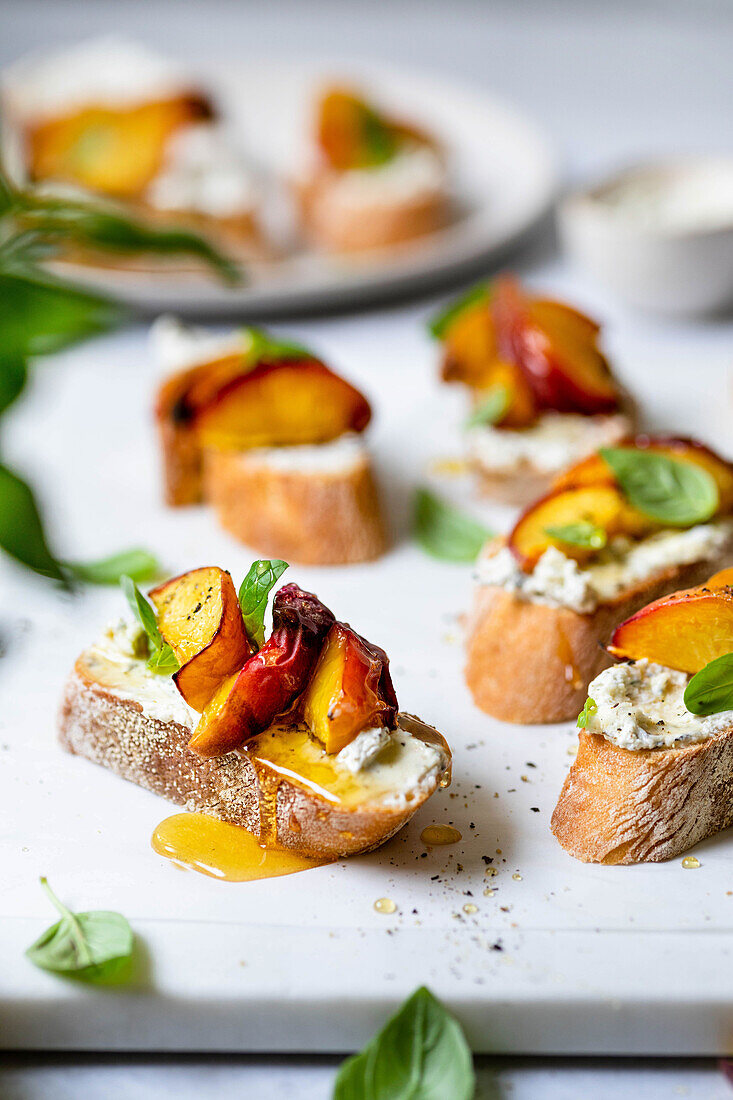Peach crostini with herbs and cream cheese